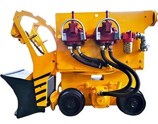 A yellow rock loader at a mine site