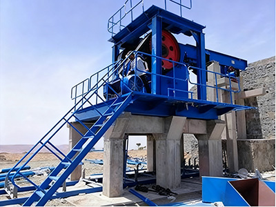 A jaw crusher spits out copper ore at a huge copper processing plant. A jaw crusher spits out copper ore at a huge copper processing plant.