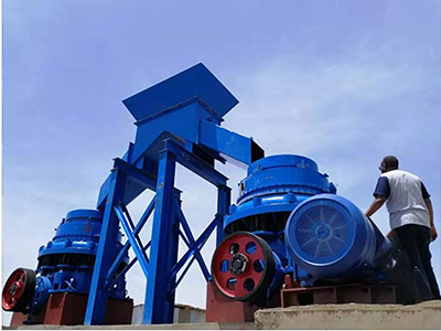 A jaw crusher spits out copper ore at a huge copper processing plant.