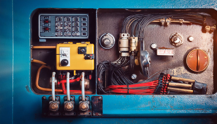 A yellow locomotive in a dark mine tunnel A yellow locomotive in a dark mine tunnel