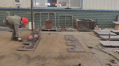 Abstract geometric illustration of steel locomotive frame fabrication with orange welding sparks and CNC cutting elements in a bold industrial style.