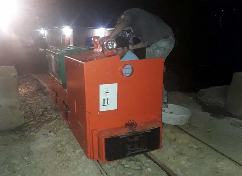 Diesel vs battery mining locomotive comparison scene.