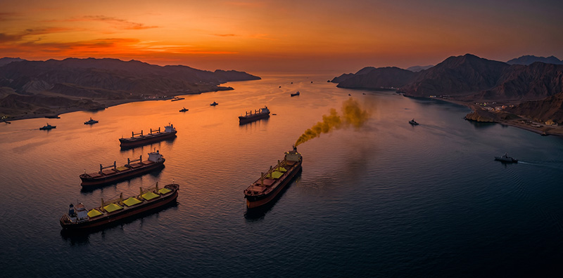 Split composition showing yellow sulfur powder and copper oxide ore connected by a broken chain, symbolizing the Middle East sulfur shortage disrupting African copper mining.